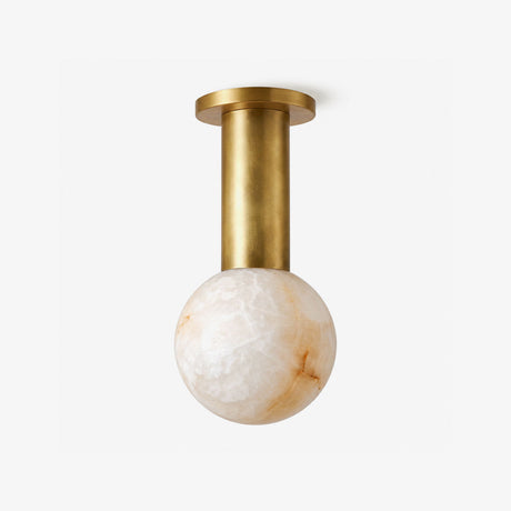 Alabaster flush mount ceiling light with a stone sphere on a brass column and canopy