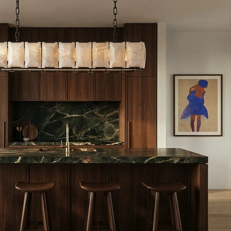 A lit stone cage above a green stone kitchen counter and stools