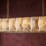 The lit panels seen close against a deep burgundy wall