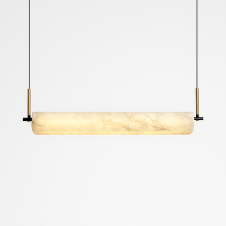 The same alabaster bar lit, the stone glowing warm from one end to the other