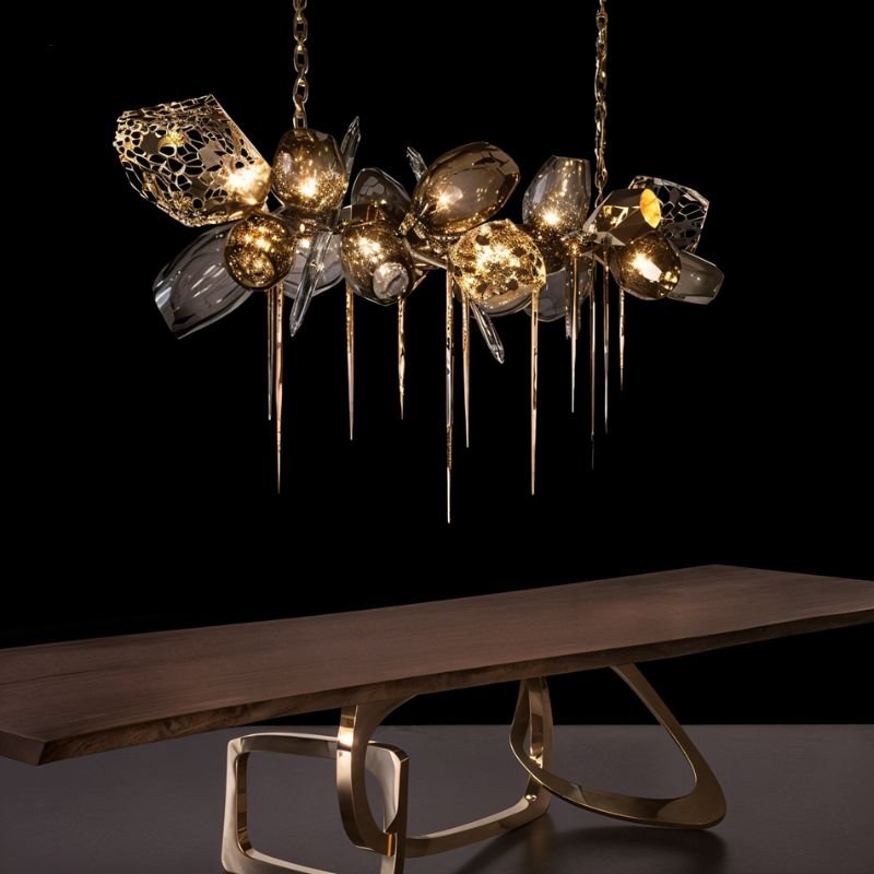 The linear version lit above a long wooden table with a sculptural gold base