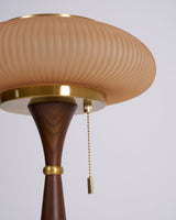 Close view of the waisted stem and the pull chain under the cap