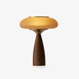 Amber glass table lamp with a fluted shade on a walnut cone, plain ground