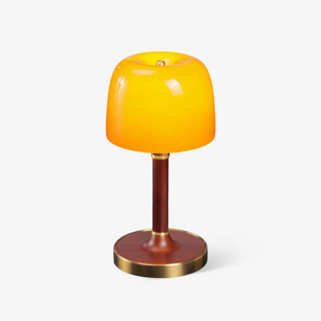 Amber table lamp with a small glass dome on a walnut stem, plain ground