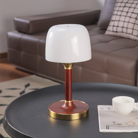 The white glass version seen from the front on a dark table