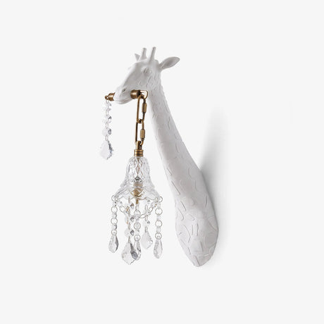 White giraffe head wall sconce holding a small hanging crystal lantern in its mouth