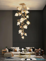 Brass branch chandelier above a seating area in a dark living room
