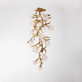 Brass branch chandelier seen from below against a white ceiling