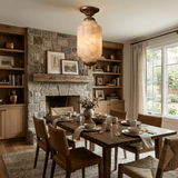 Antique brass stone ceiling light in a dining room with a stone fireplace and shelves