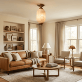 Antique brass stone ceiling light above a leather sofa in a room with two windows