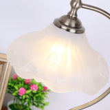 Close view of the frosted glass shade showing the petal shaped rim