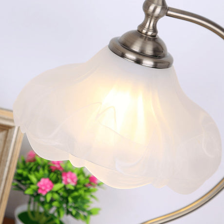Close view of the frosted glass shade showing the petal shaped rim