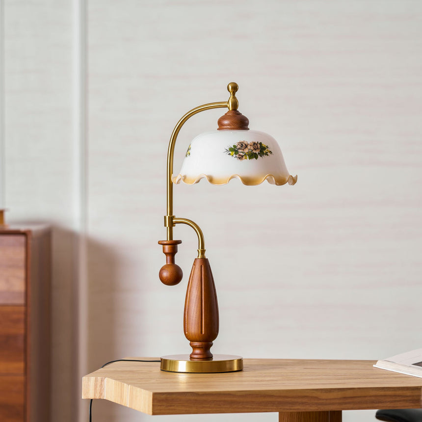 Antique brass table lamp unlit on a wood table in daylight