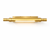 The tube in polished gold, the glow running the length of the body