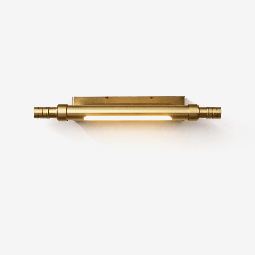 Brass tube lit end to end, knurled collars closing it at both ends