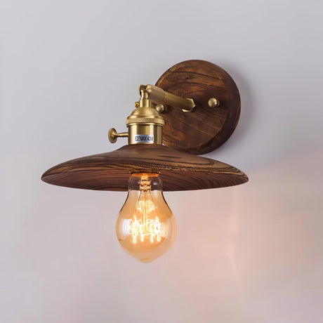 Close view of the lit fitting, the Edison bulb under the walnut shade
