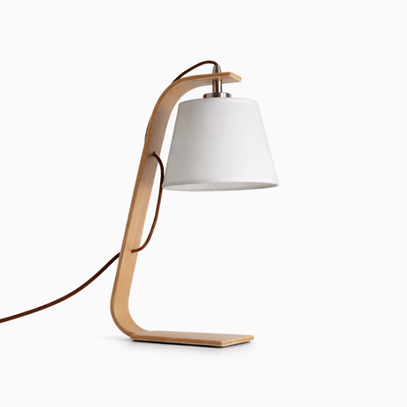 Bentwood arc lamp in light wood with a white shade, plain ground