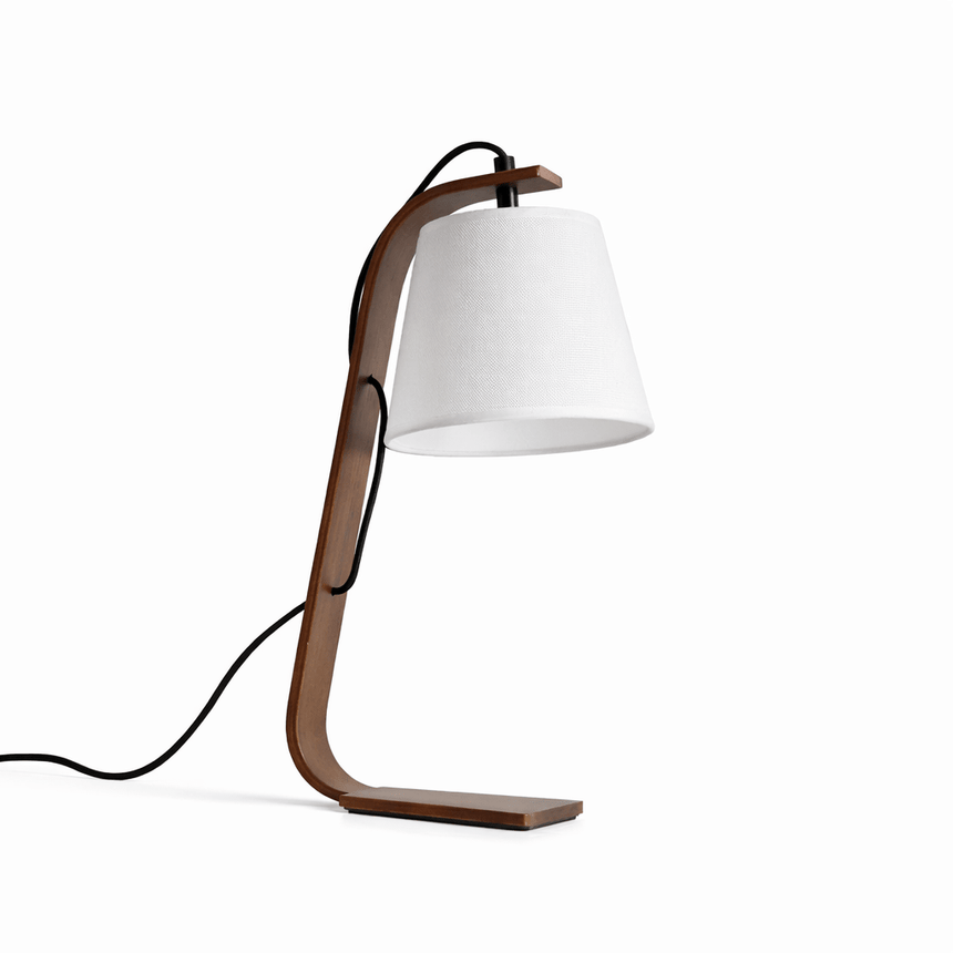Bentwood arc lamp in walnut with a white shade on a plain ground
