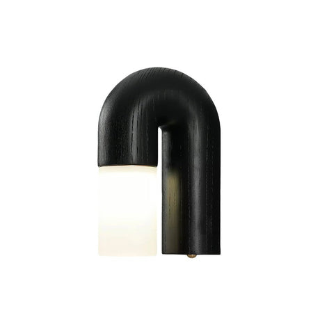 The black arch seen from the front, the white diffuser lit inside it
