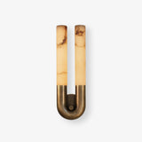 Arch wall sconce with two stone tubes rising from a curved bronze base