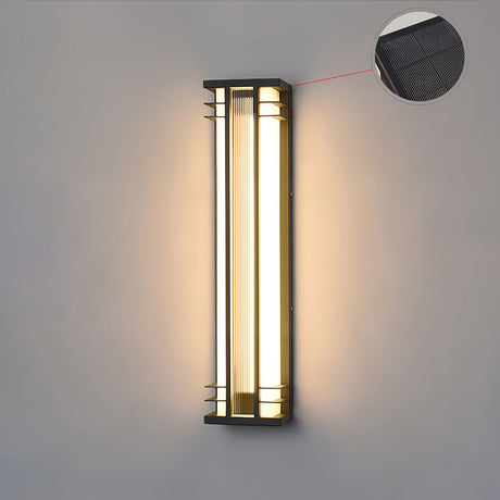 The solar cell shown beside the lit body of the fixture on a wall