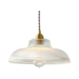Clear prismatic glass shade with a brass top on a plain gray background