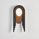 The lamp seen at an angle, the uneven lengths of the black stepped bands