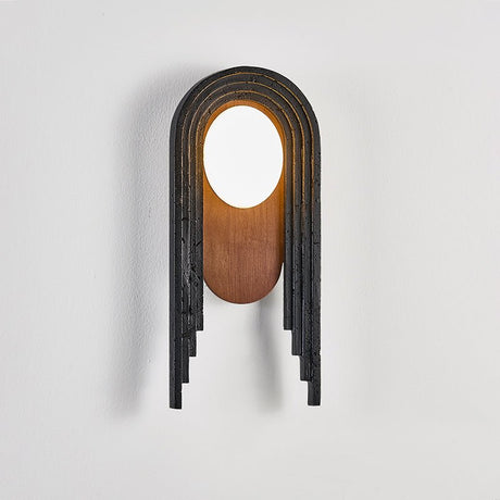 The lamp seen at an angle, the uneven lengths of the black stepped bands
