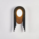 The lamp lit, the walnut oval glowing warm under the white disc