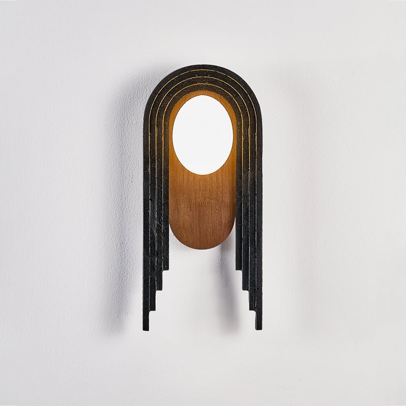 The lamp lit, the walnut oval glowing warm under the white disc