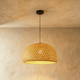 A deep bamboo dome woven in an open diamond pattern