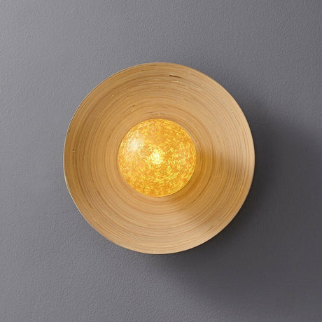 The bamboo disc lit, the crackled gold orb glowing at the middle of the rings