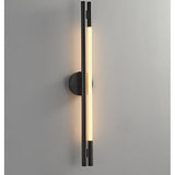 The lit strip seen close on a gray wall, the black frame in shadow