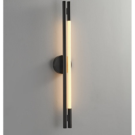 The lit strip seen close on a gray wall, the black frame in shadow