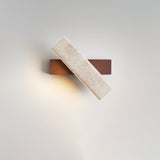 The dark walnut version seen from the front with the travertine bar across it