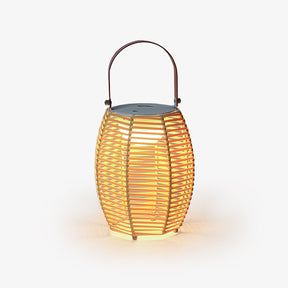 Ribbed lantern in a warm yellow tone with a dark arched carry handle