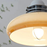 Close view of the lit underside of the shade showing the bulb inside