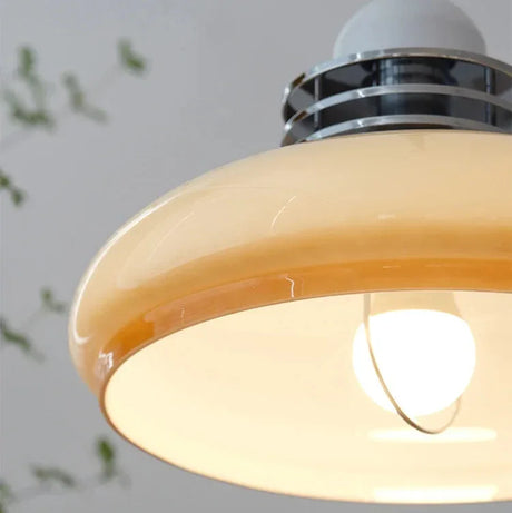 Close view of the lit underside of the shade showing the bulb inside