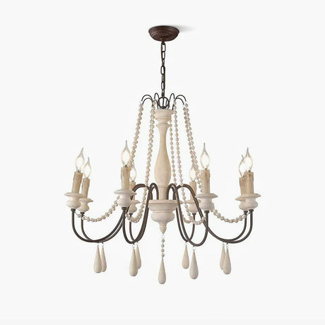 Wooden bead strands swagged across scrolling iron arms with candle lamps above