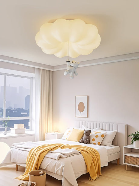 Bear ceiling light lit in a bright bedroom with a city view through the window