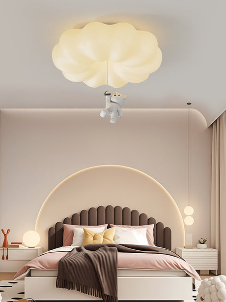 Cloud bear ceiling light above an arched headboard with pendant lights either side