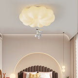 Bear ceiling light lit above a fluted headboard in a room with warm lighting