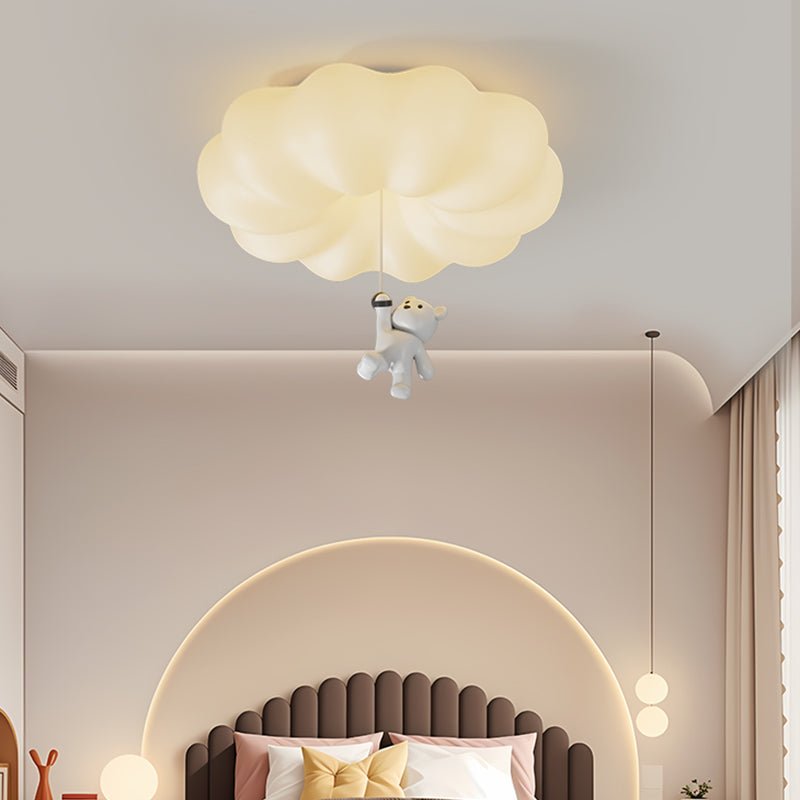 Bear ceiling light lit above a fluted headboard in a room with warm lighting