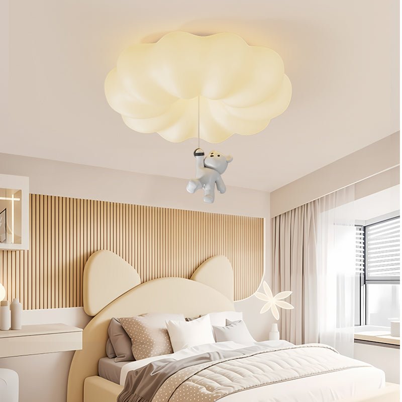 Cloud bear ceiling light in a bedroom with a bear ear headboard and a window