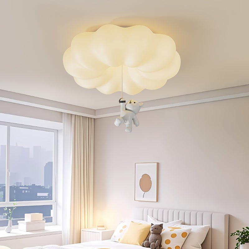 Bear ceiling light lit in a child bedroom with a framed print and a city window