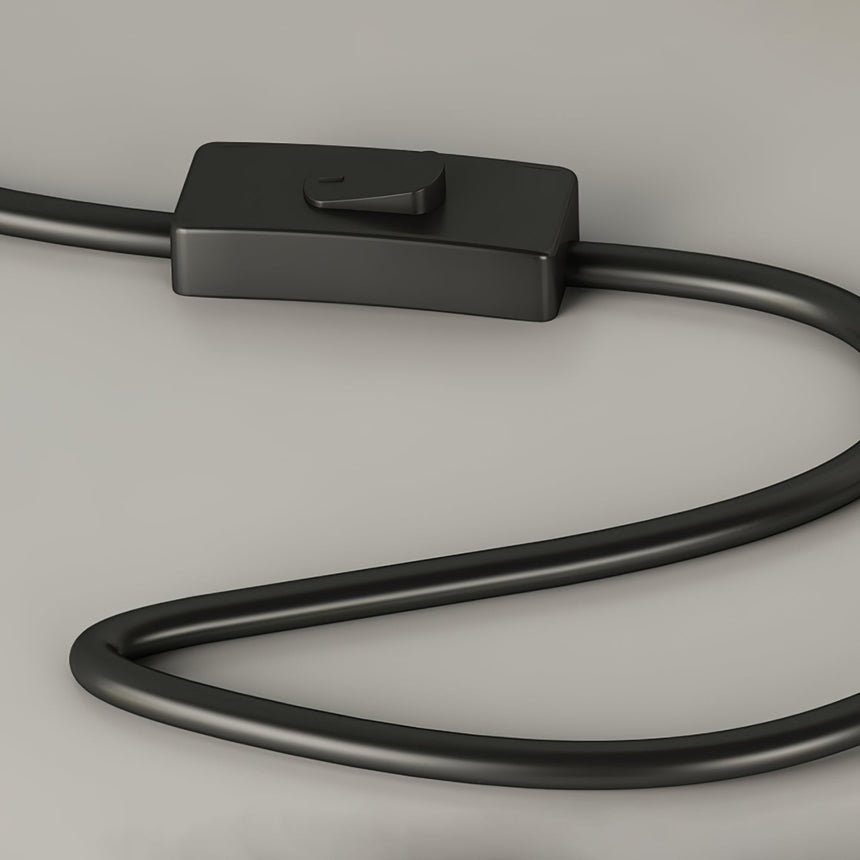 Close view of the inline push button switch on the black power cord