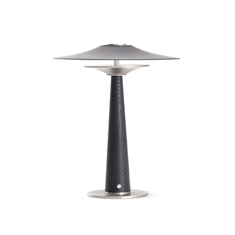 Bedroom table lamp seen in full height against a plain ground