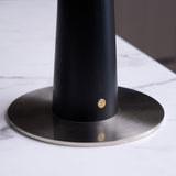 Close view of the brushed nickel foot and the tapered black column