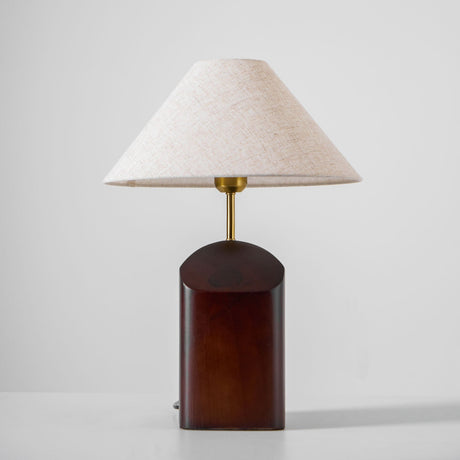 Close view of the curved walnut base and its cut face