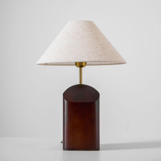 Close view of the curved walnut base and its cut face